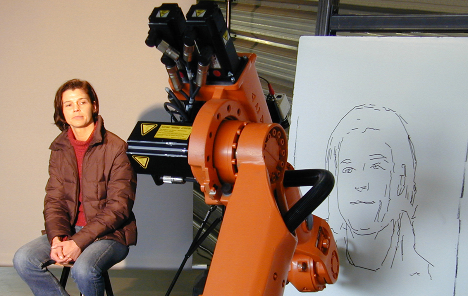 Picture: The industrial robot sketches a portrait