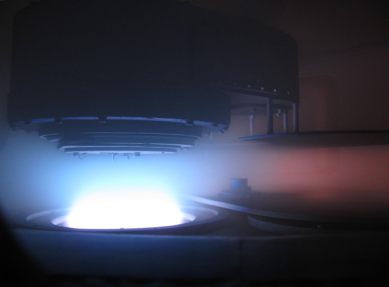 View inside vacuum chamber during the coating process.