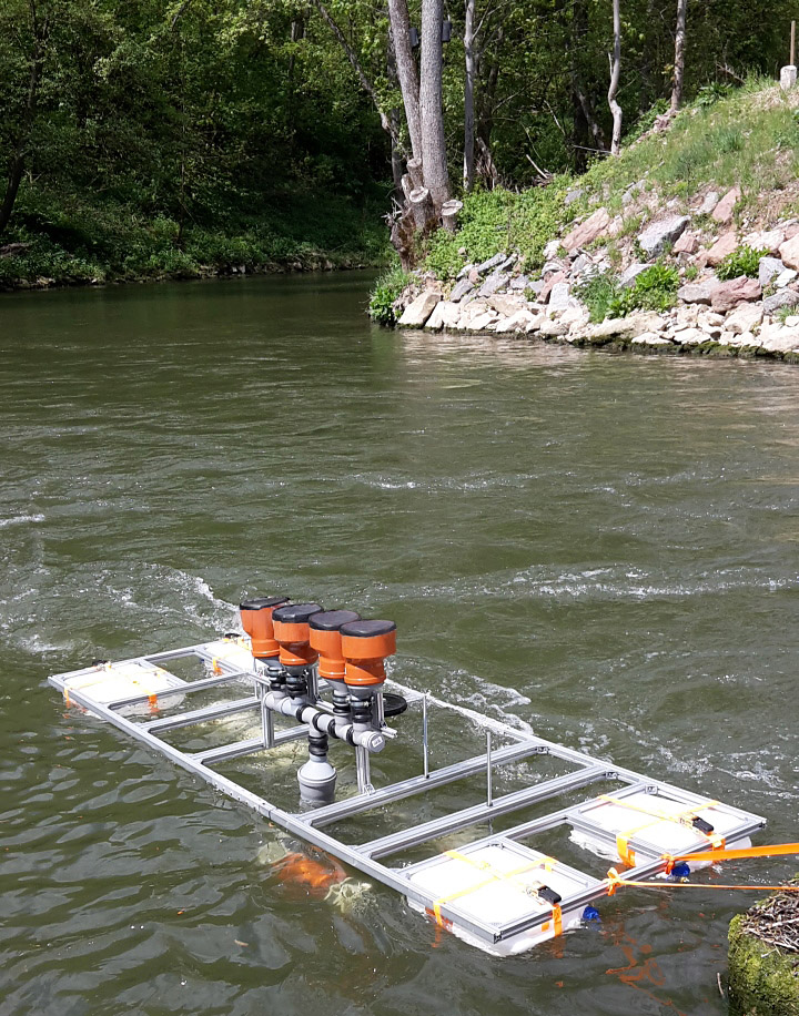 Field testing of DEGREEN generators in a small river – the silicone membranes are mechanically excited by negative pressure within the perfused Venturi tubes under the float.