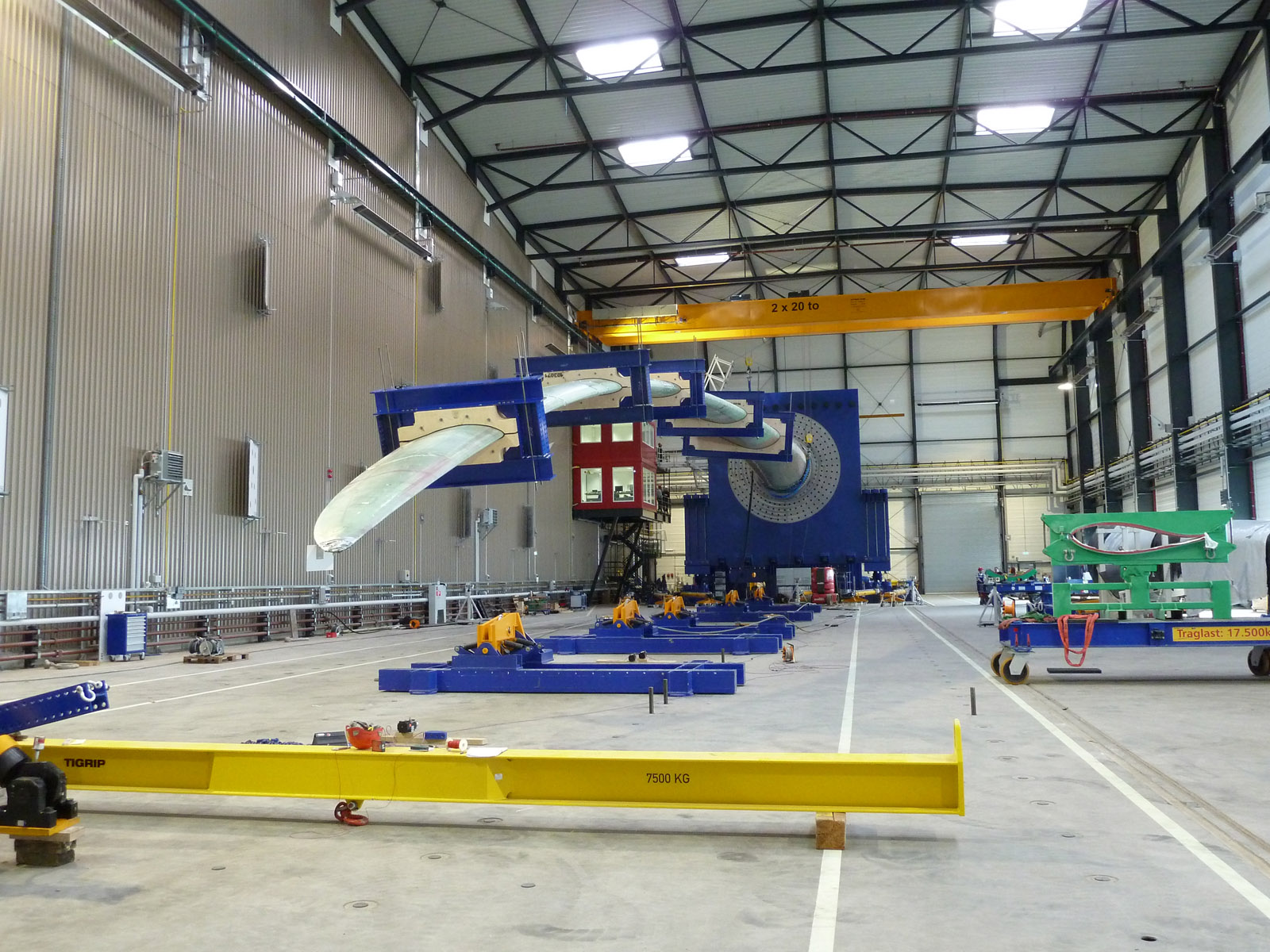 Static testing of the trailing edge of a rotor blade. Acoustic emission sensors were able to detect and locate all defects.