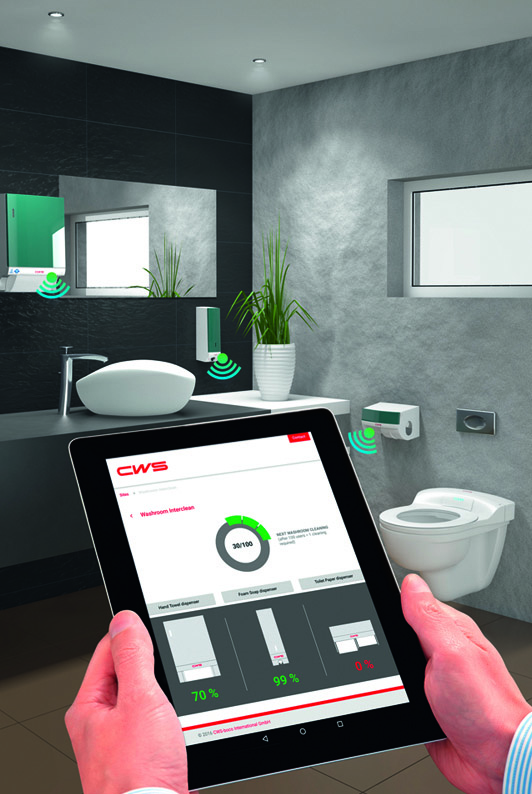 Checking dispensers with a tablet computer in a networked washroom.