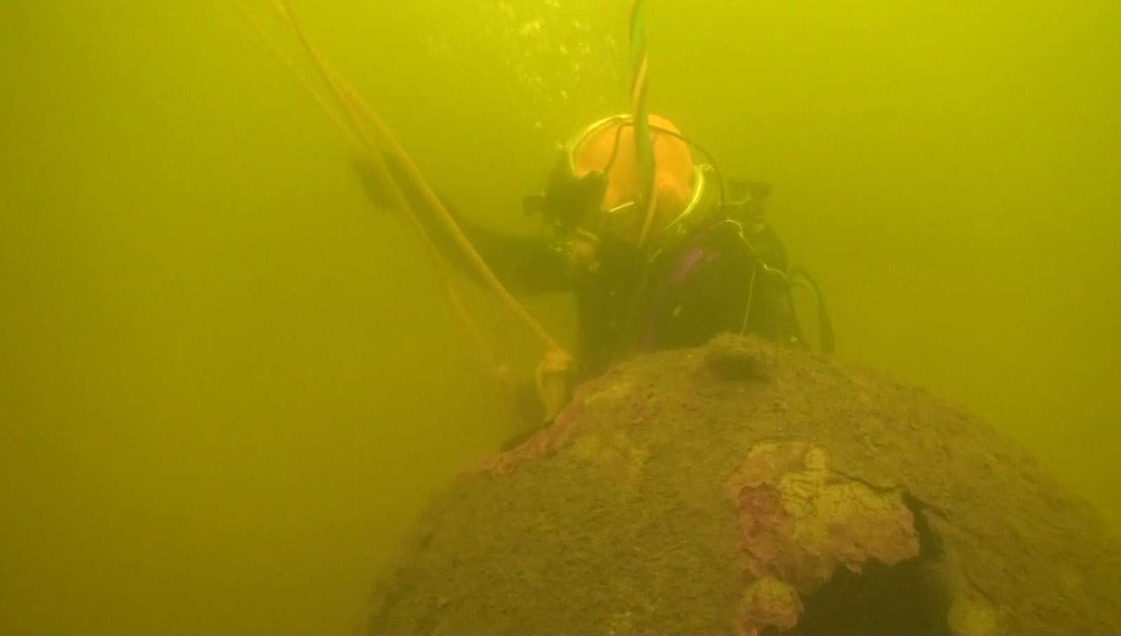 Diver with moored mines.