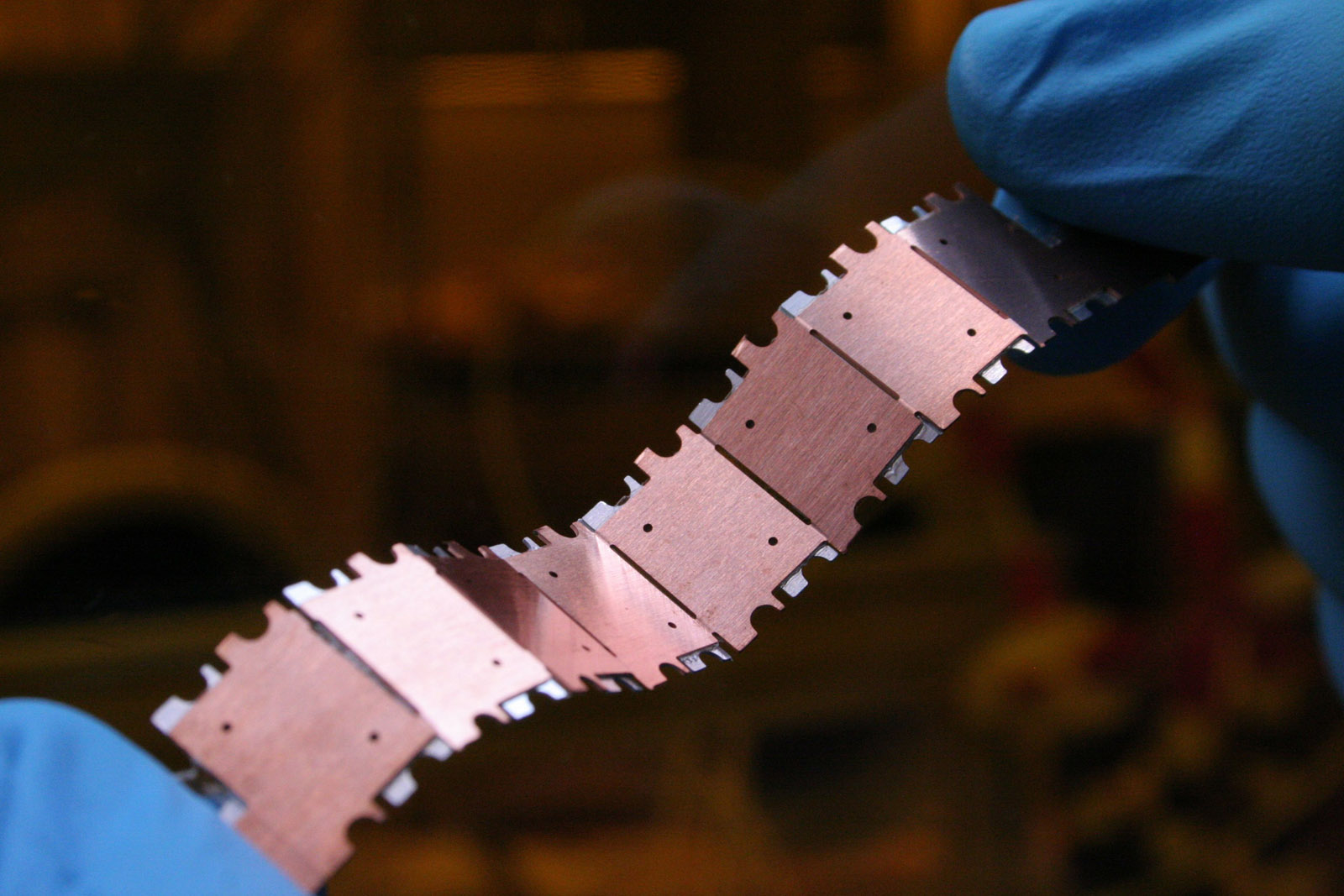 Mechanically flexible micro battery stripe made from segmented battery cells