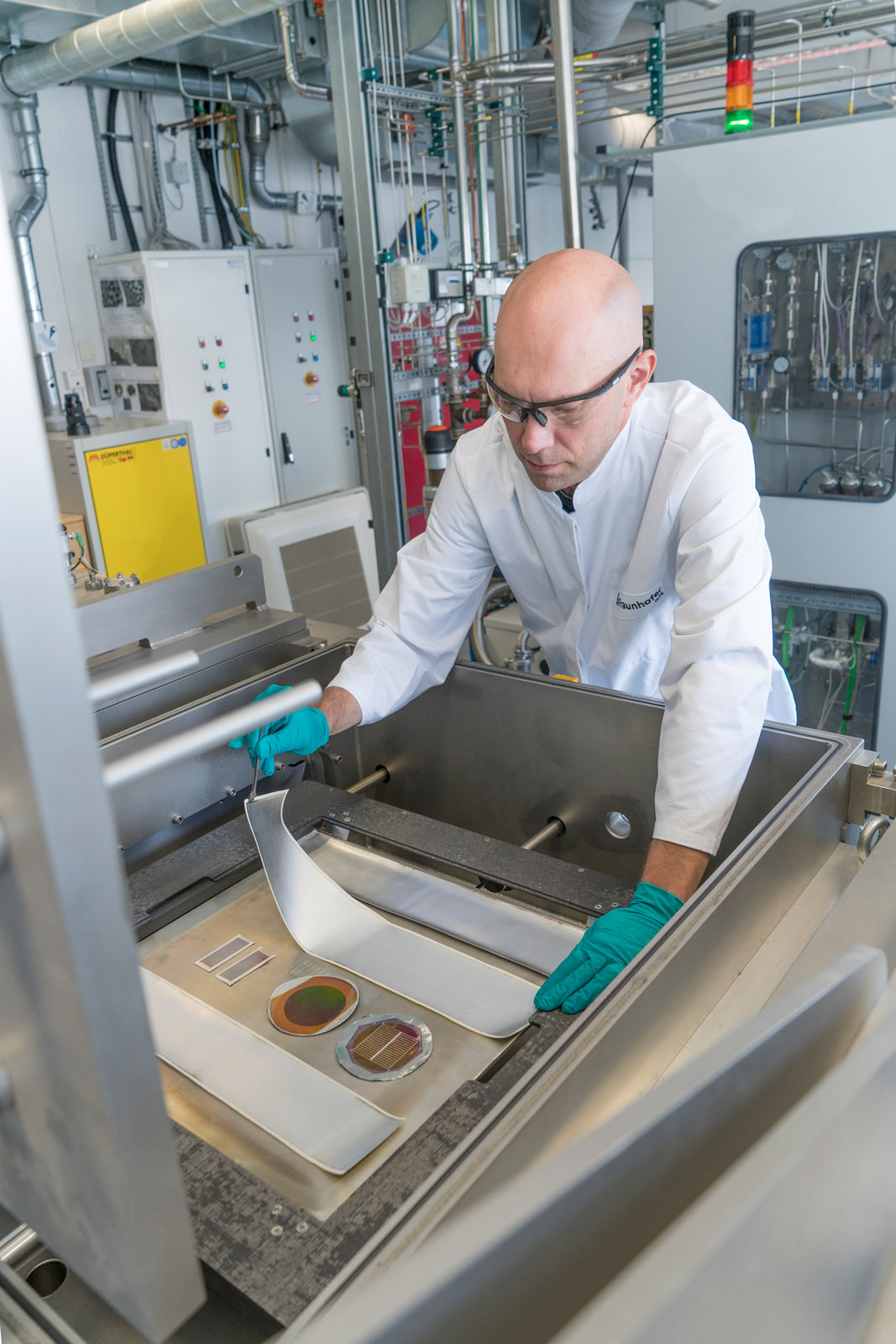 Dr. Jonas Sundqvist, group manager for thin-film technology, with prototype textile-based solar cells.