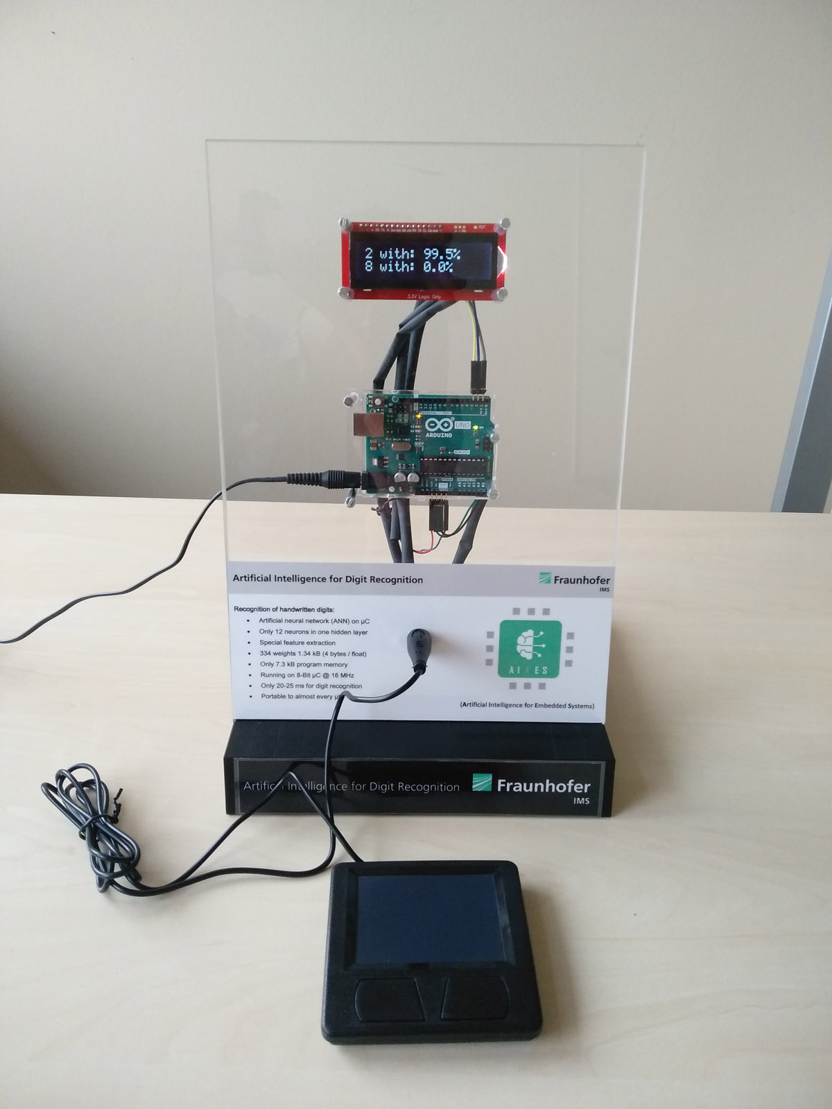 AIfES demonstrator for handwriting recognition. All functions have been integrated on the Arduino UNO, which reads the sensor values of the touchpad, performs number recognition and outputs the result to the display.