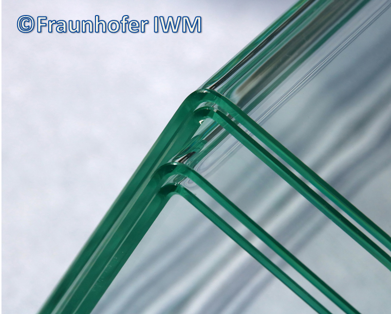 The results of the glass-bending process: glass panes bent at a 90° degree angle.