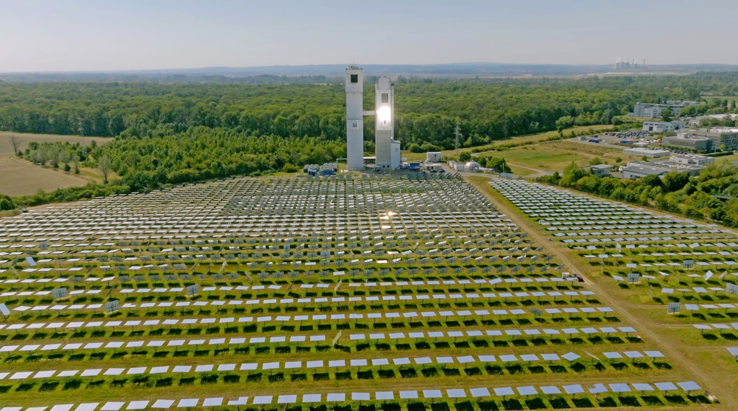 Aerial view of the solar tower and the mirror field at DLR, Jülich. The mirror field focuses the solar radiation onto the solar tower and heats up the solar receiver.